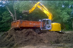 afgraven en laden van de af te voeren grond
